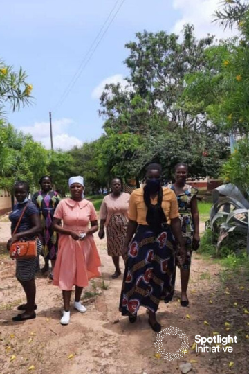 small group of women walking in rural area
