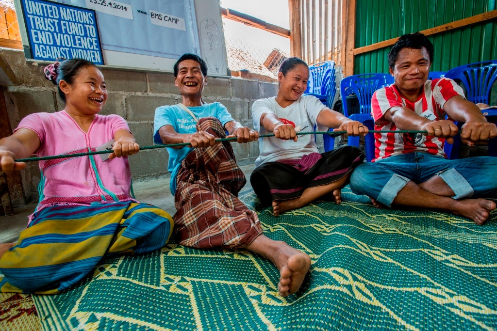 Refugee couples participate in a relationship building game during a session in the "Peaceful Families Initiative" run by IRC in Ban Mae Surin Refugee camp in Mae Hong Son province, Thailand